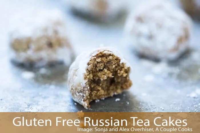 Deep brown round cookies covered in powdered sugar